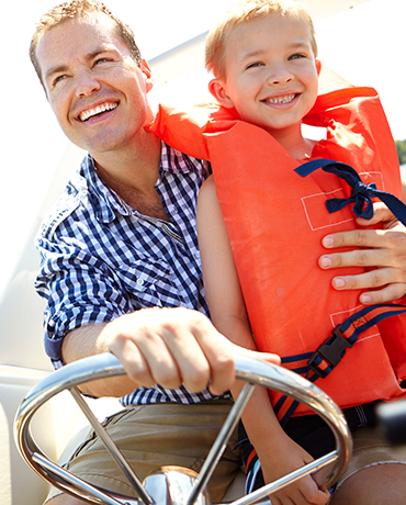 Dad and child on boat