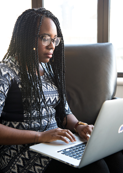 Full size image of woman on computer wearing watch