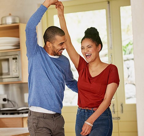 couple dancing in house