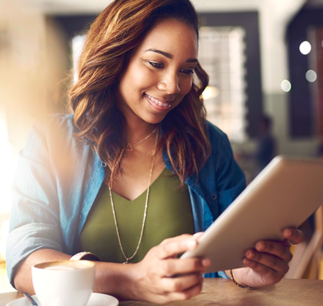 A woman using an iPad to do her banking business