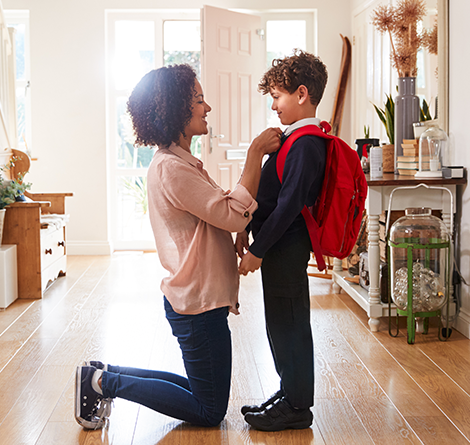 Mom straightening boys tie