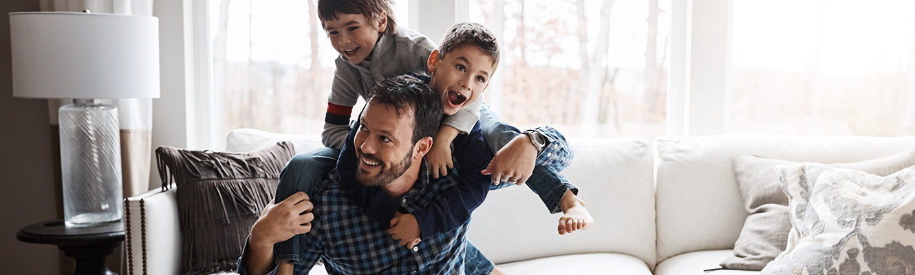 Dad playing with sons