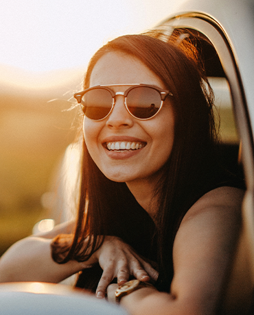 girl in car smiling