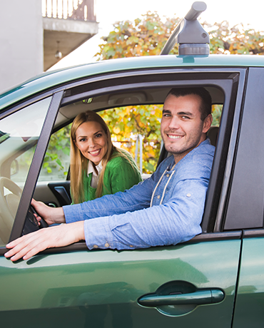 couple in green car