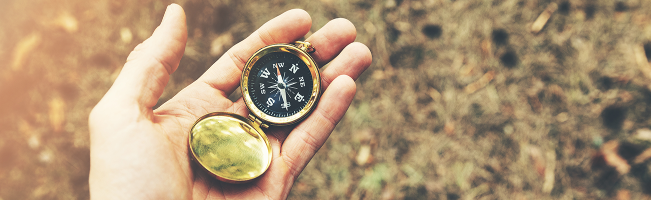Man holding compass