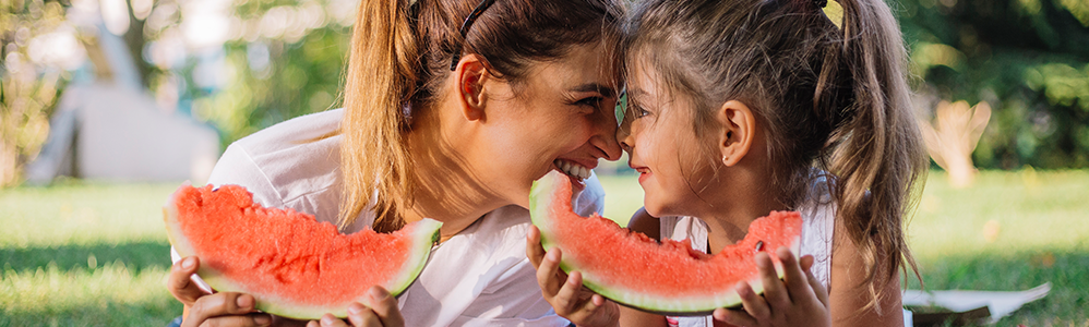 Mom and Daughter eating watermelon