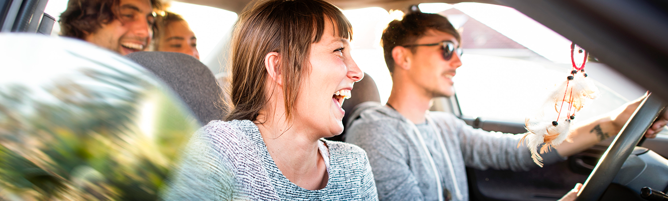 people in car laughing