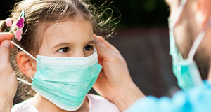 Young girl wearing facemask