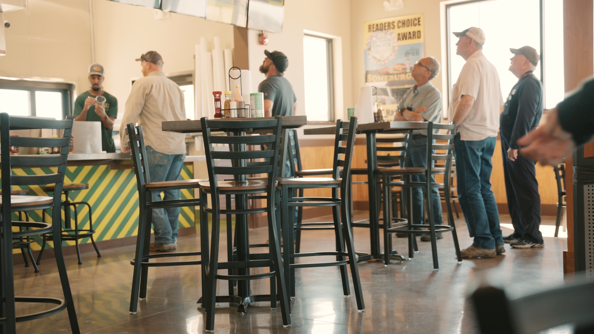 People waiting in line at a restaurant.
