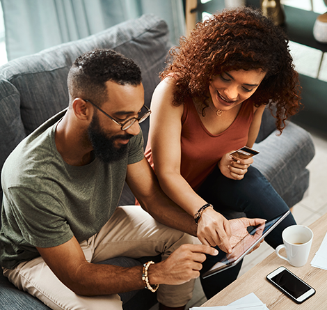 Couple with ipad and credit card