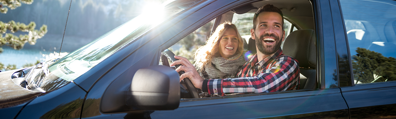 couple smiling in car