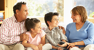 family sitting on couch