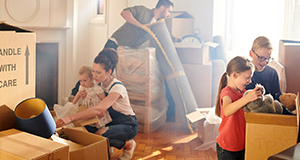 family unpackng boxes