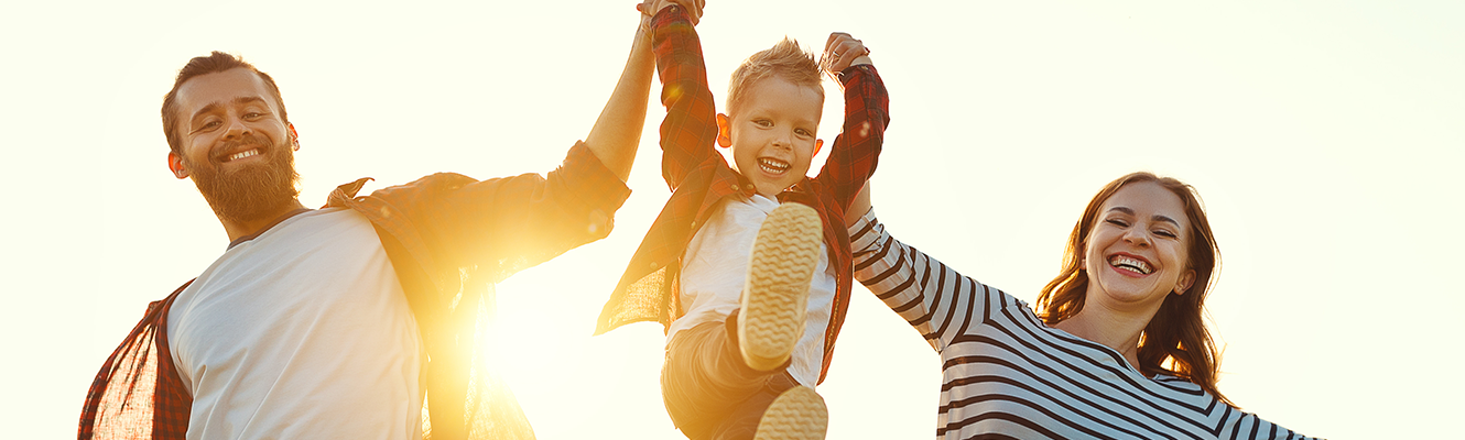 parents swinging child