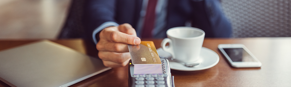 man paying with credit card