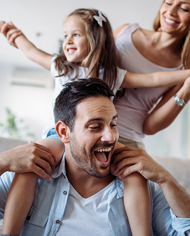 Daughter on Dad's shoulders