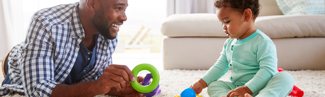 Dad playing with baby