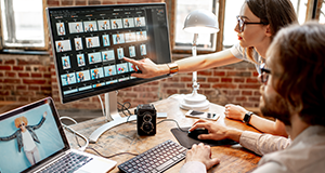 two people working on computer