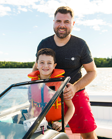 Dad and child on boat