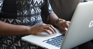 Woman on Computer wearing watch