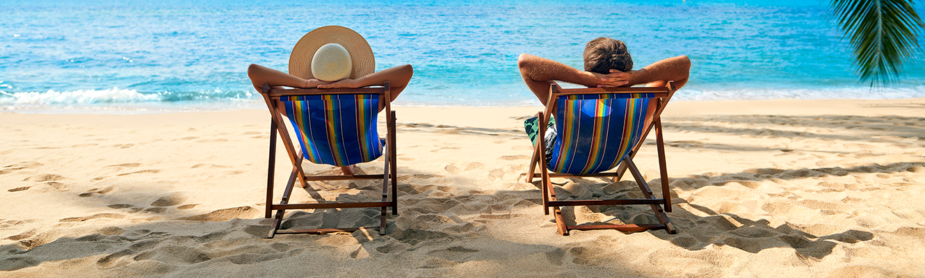 two people at beach in chairs