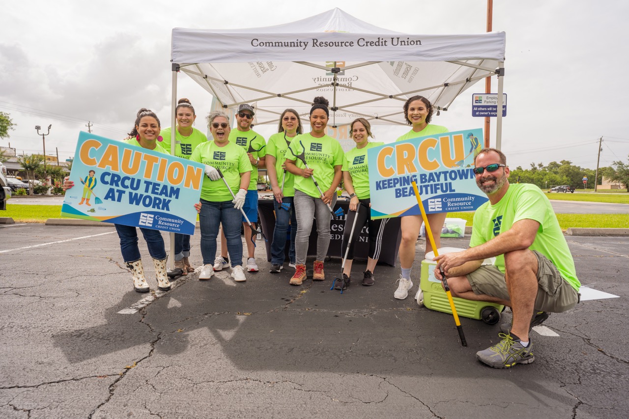 A group of Community Resource Credit Union employees helping the community out.