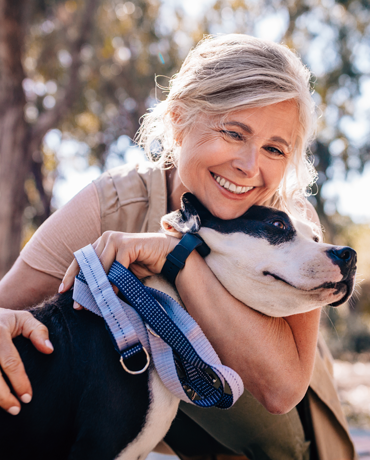 Woman hugging her dog