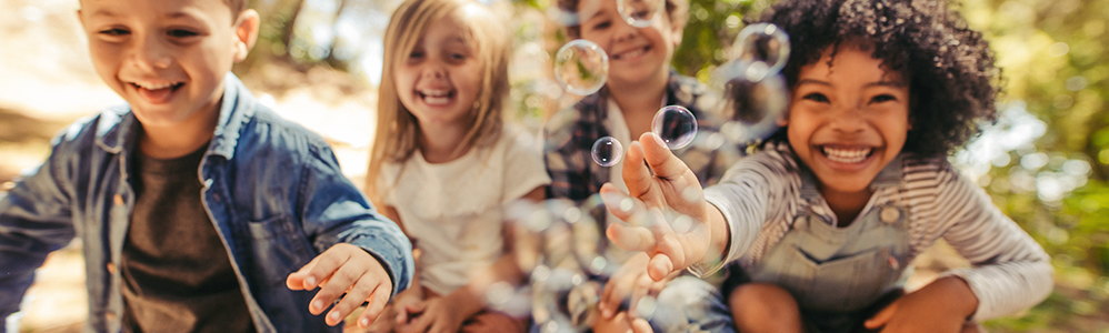 kids blowing bubbles