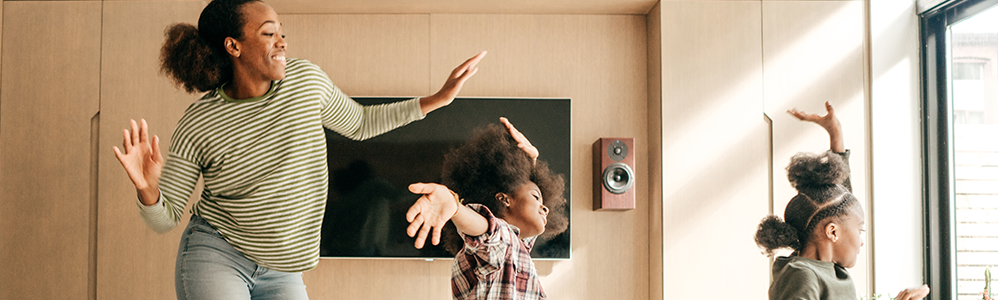 mom dancing with daughters