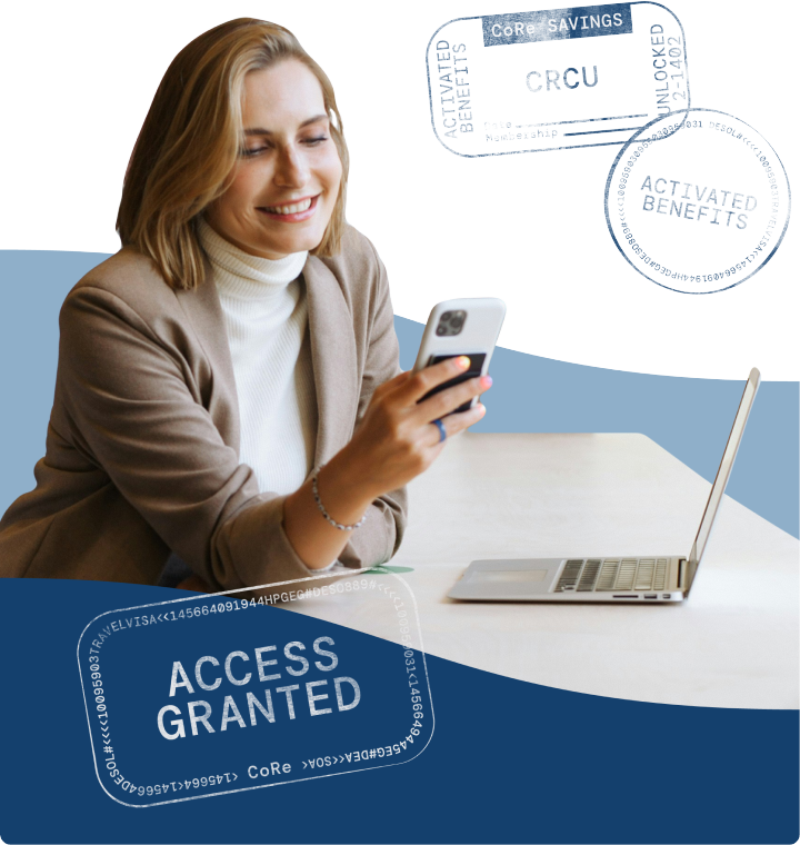 business woman at desk with phone and laptop