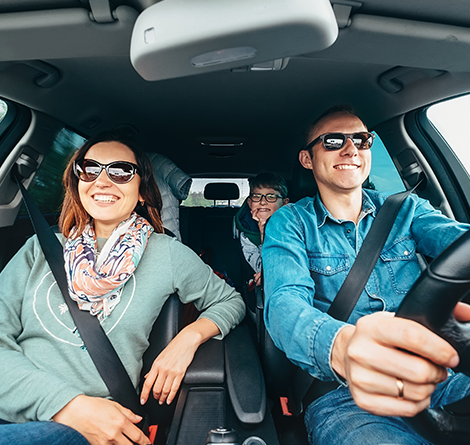 Family in car with seat belts on