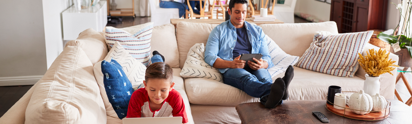 family relaxing on couch