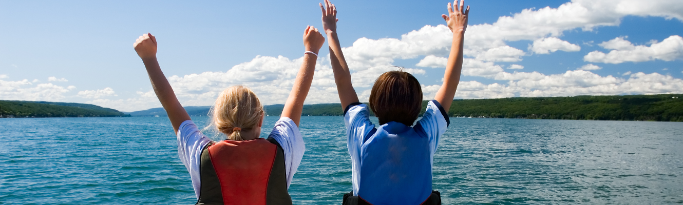 two people on boats with life jackets