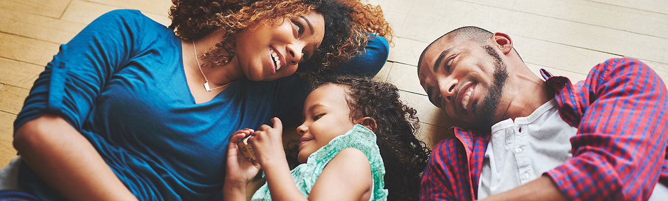 family laying on floor together