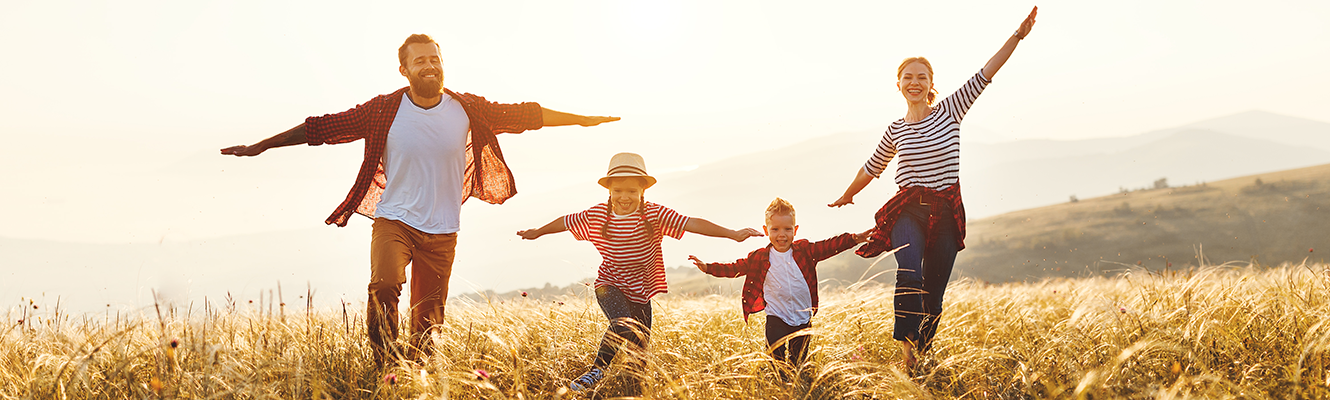 family in field playing