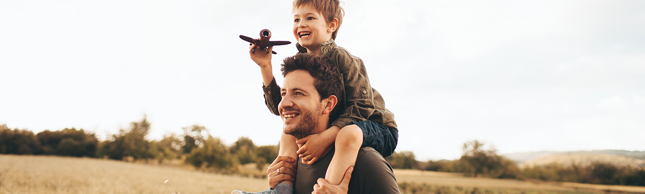 kid on his dad's shoulders