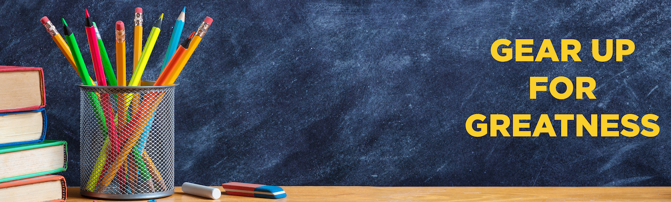 Promotion for back to school season, with school supplies sitting on a desk.
