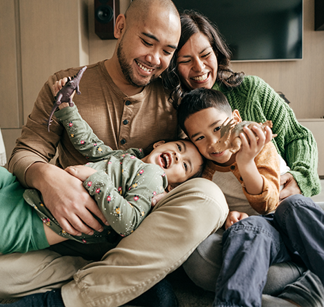 family snuggling and playing