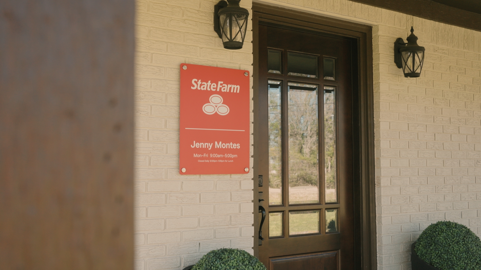 Front of house shown with StateFarm sign.